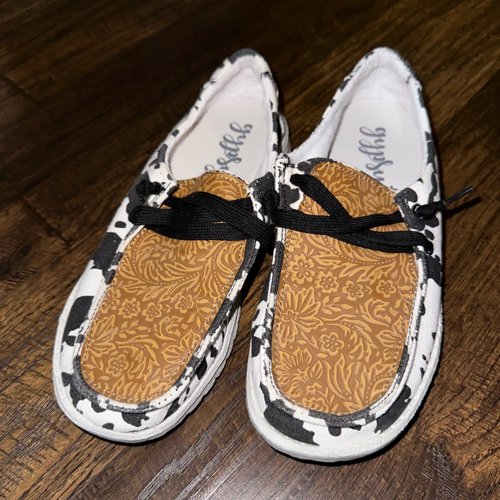 Cow print slip on shoes